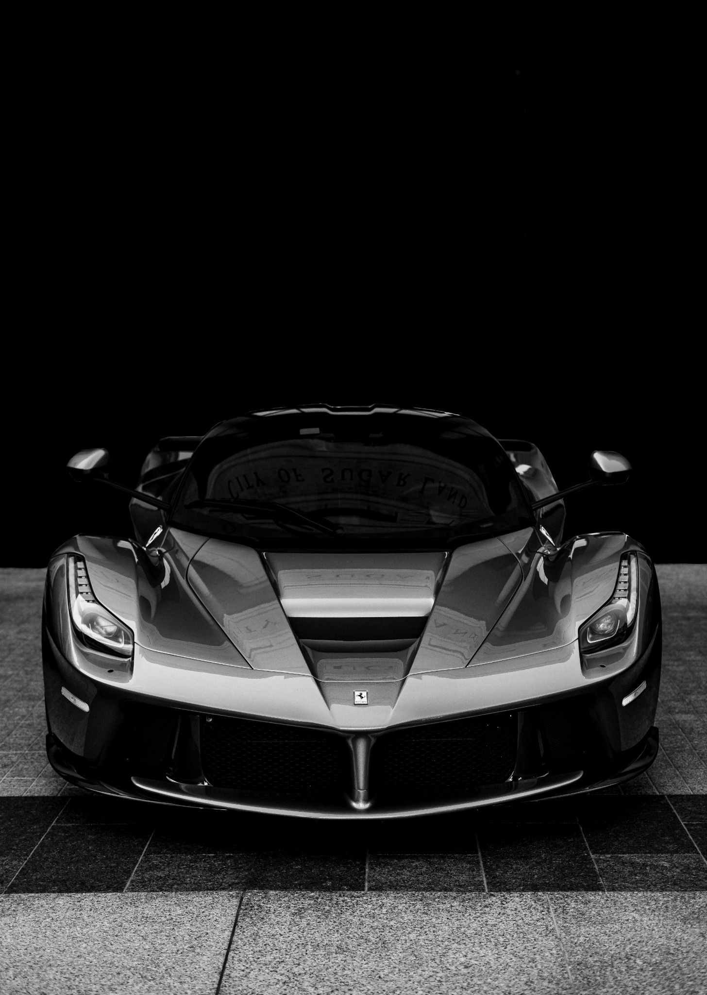 Ferrari LaFerrari photographed from the front in black and white
